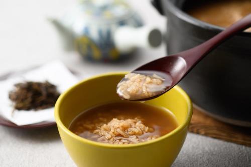 a spoon is in a bowl of cereal at Grand Mercure Nara Kashihara in Kashihara