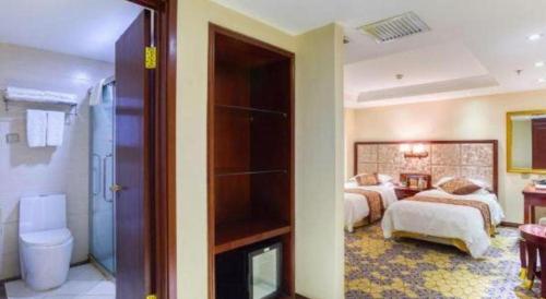 Katil atau katil-katil dalam bilik di Changchun Global Hotel
