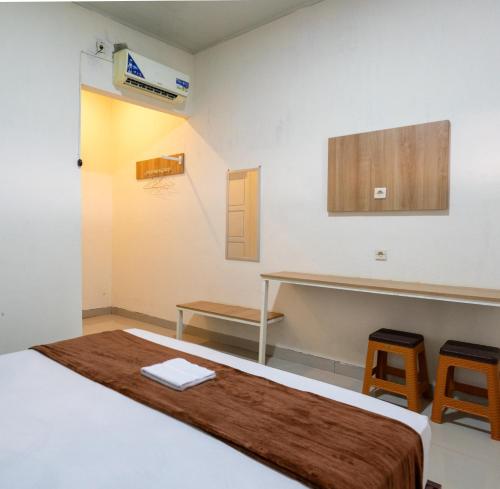 Кровать или кровати в номере Grand Soe Hotel