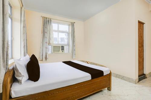 a bed in a room with a window at Hotel O Stay Inn & Restaurant in Gulzārbāgh