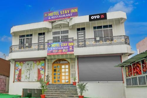 a building with a sign on top of it at Hotel O Stay Inn & Restaurant in Gulzārbāgh