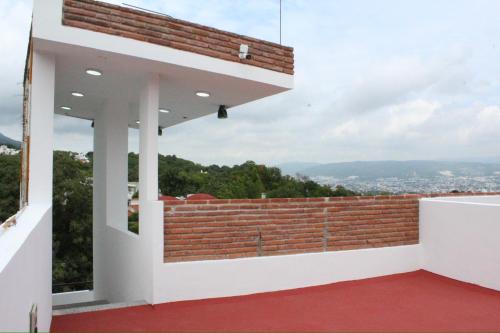 a view from the balcony of a house at Hotel Monkey House Tuxtla Gutiérrez in Tuxtla Gutiérrez