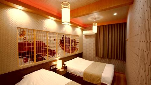 Postel nebo postele na pokoji v ubytování お宿寧々OyadoNene板橋 池袋3分新宿9分