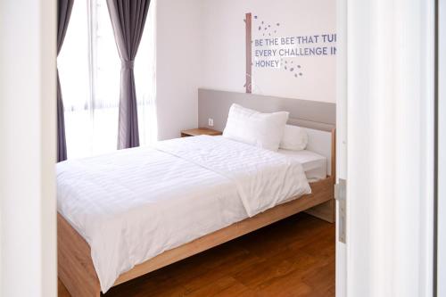 Кровать или кровати в номере Aiko Villa Bandung