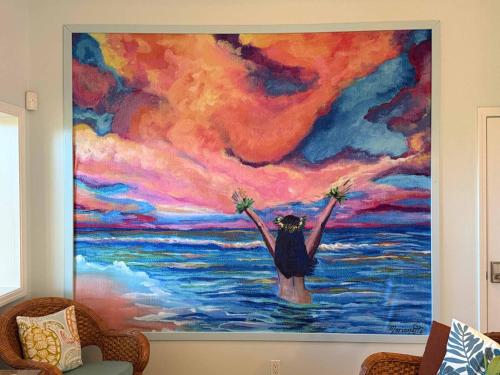 a painting of a woman standing in the water at Half Off Bed & Breakfast Suite Steps from Beach with AC in Napili-Honokowai