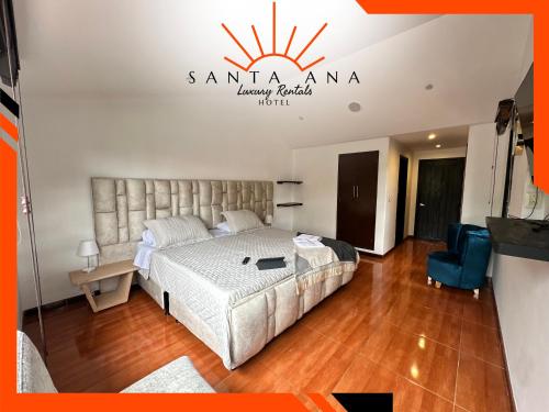 a bedroom with a bed and a sign on the wall at Hotel Santa Ana Luxury Rentals - 111 in Estación El Salto