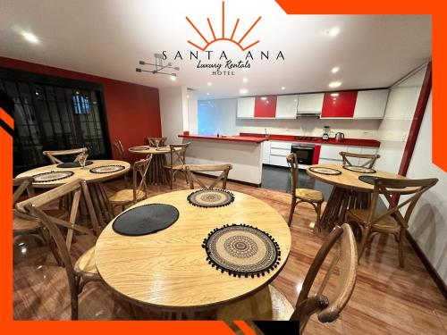 a restaurant with tables and chairs and a kitchen at Hotel Santa Ana Luxury Rentals - 111 in Estación El Salto