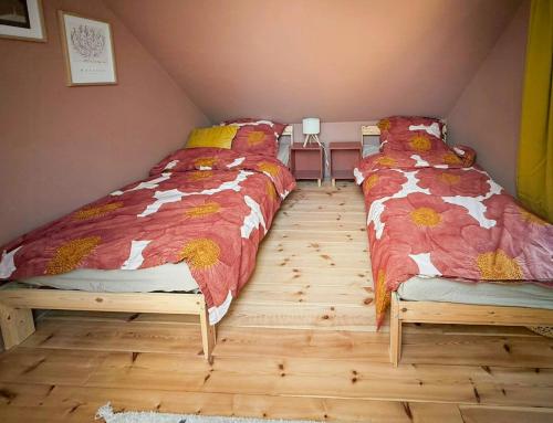 a bedroom with two twin beds in a attic at Design House With Garden In The Heart Of Småland in Gullabo