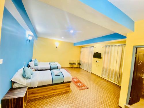 a bedroom with a large bed in a room at Om Green Tortoise Lachung in Lachung