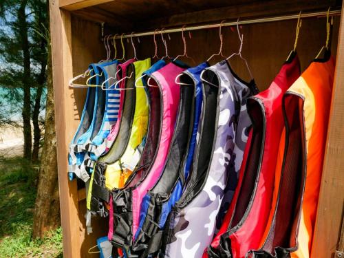 a bunch of colorful umbrellas hanging on a rack at Le GRAND BLEU - Vacation STAY 31718v in Akaoki