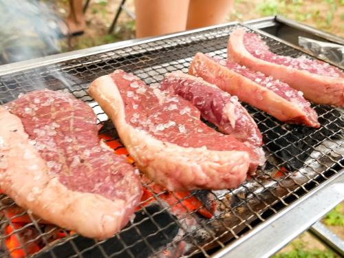 a group of meat cooking on a grill at Le GRAND BLEU - Vacation STAY 31718v in Akaoki
