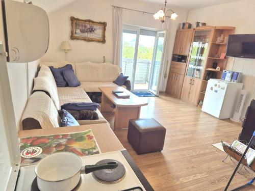 a living room with a couch and a table at Zeleni horizont 