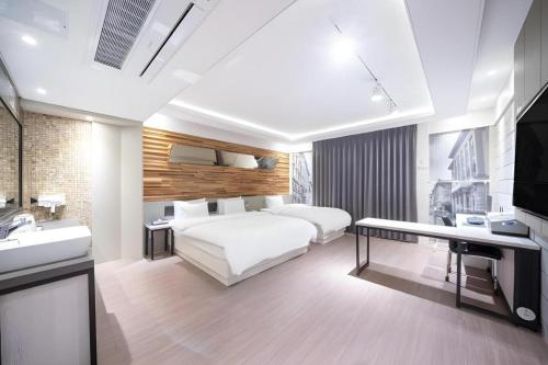 Ένα ή περισσότερα κρεβάτια σε δωμάτιο στο Pohang Hotel View