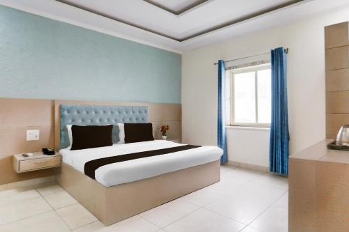 Katil atau katil-katil dalam bilik di Super Hotel O Heera Nagar Formerly Cosy stay