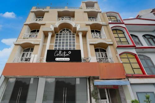 a building with a sign on the side of it at Super Collection O Haldwani Railway Junction Formerly Hotel Kanta in Haldwāni
