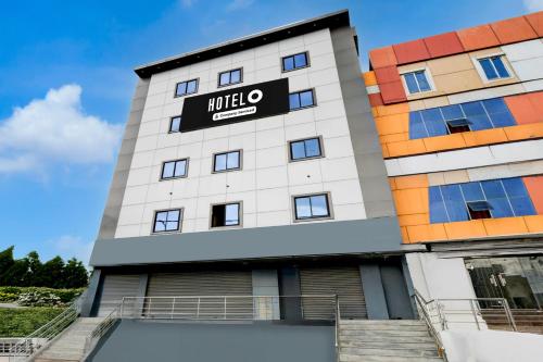 a building with a hotel sign on it at Super Hotel O LB Nagar Metro Station Formerly Virat residency in Surūrnagar