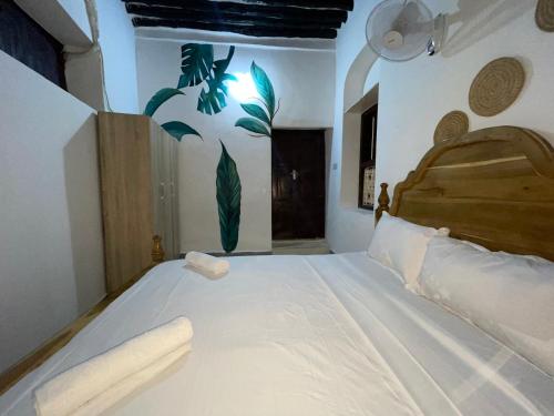 Ένα ή περισσότερα κρεβάτια σε δωμάτιο στο Vuga House