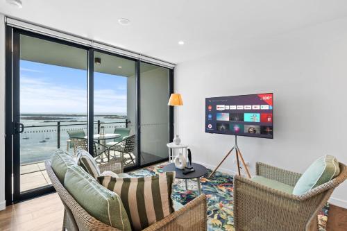 a living room with a view of the ocean at CASSA MQ - Oceanview 2BR Southport Gem Managed by The Cassa in Gold Coast