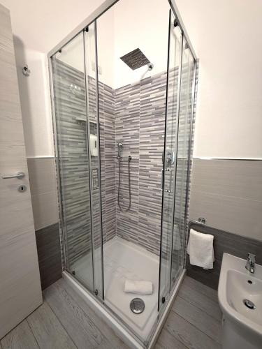 a bathroom with a shower and a sink at Bentus B&B in Villasimius