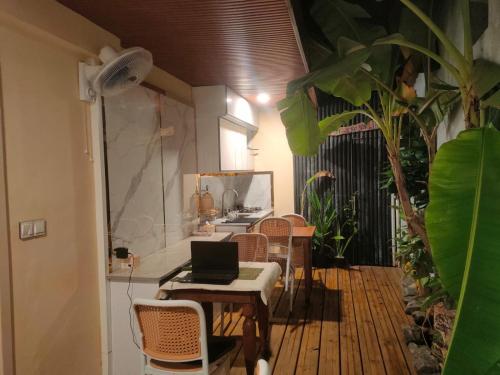 a room with chairs and a laptop on a table at ROYAL Village Dhangethi Maldives in Male City