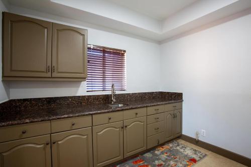 a kitchen with a sink and a window at Arroyo Pinion Hotel, an Ascend Collection Hotel in Sedona