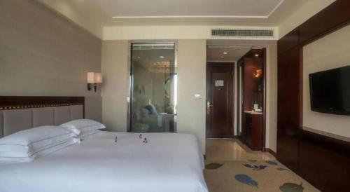Dong Cheng Hotelにあるベッド