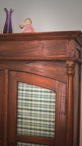 a wooden door with a window on top of it at Barcolana Lodge Hostel in Trieste