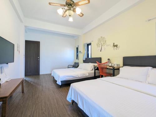 Ein Bett oder Betten in einem Zimmer der Unterkunft Hoyu''s House B&B