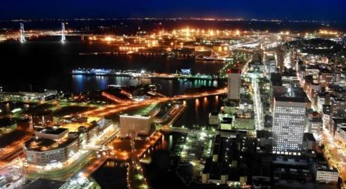 a view of a city at night with lights at Yokohama Royal Park Hotel in Yokohama