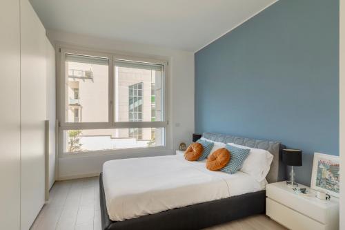 Ένα ή περισσότερα κρεβάτια σε δωμάτιο στο CityLife Modern Comfort Suite