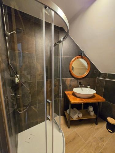 a bathroom with a shower and a sink at Savinjski raj in Mozirje