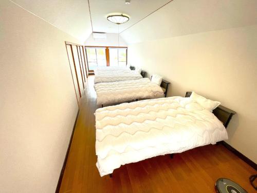 Postel nebo postele na pokoji v ubytování West Lake Villa Imazu Umehara - Vacation STAY 18948