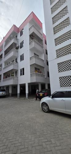 a car parked in front of a building at Stayswithyezzy in Mtwapa