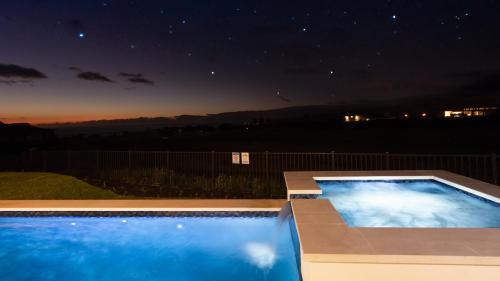 a swimming pool at night with the stars at ❤PiH❤ Hale Moana Heated Private Pool Spa Detached Ohana Suite in Waimea