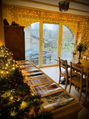 a dining room table with a christmas tree on it at Les Gîtes de Sprimont - Le Cottage in Sprimont