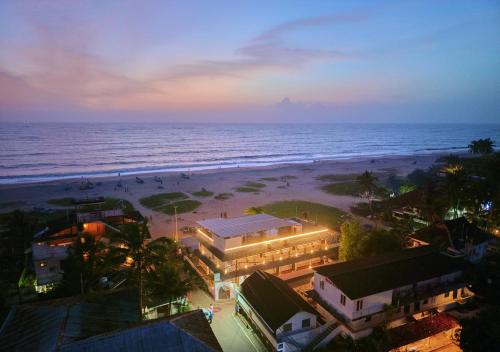 an aerial view of a beach at night at Alleppey Holiday Beach Resort By VOYE HOMES in Alleppey