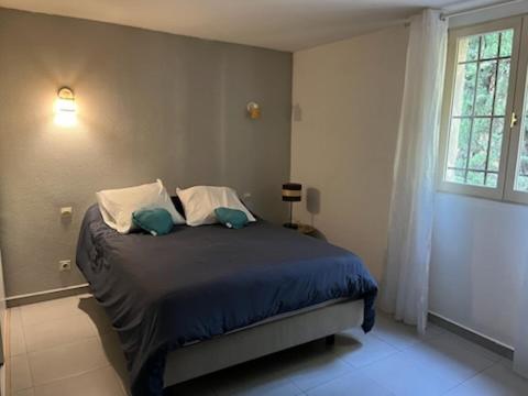 Postel nebo postele na pokoji v ubytování Maison d hôtes Las Pistaxes