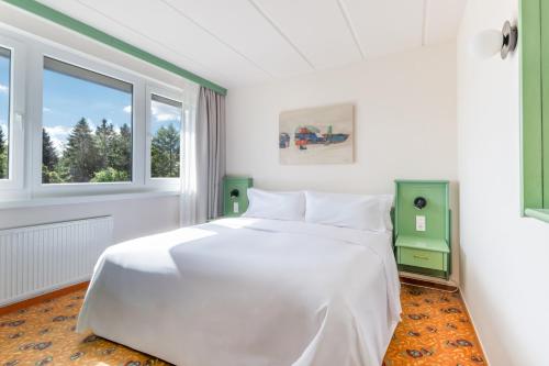Ein Bett oder Betten in einem Zimmer der Unterkunft IFA Schöneck Hotel & Ferienpark