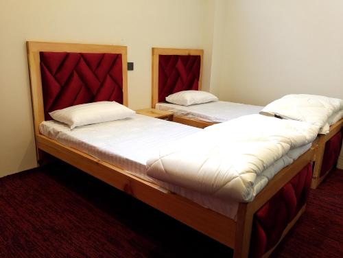 Un ou plusieurs lits dans un hébergement de l'établissement Fialong Hotel