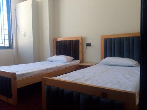Un ou plusieurs lits dans un hébergement de l'établissement Fialong Hotel