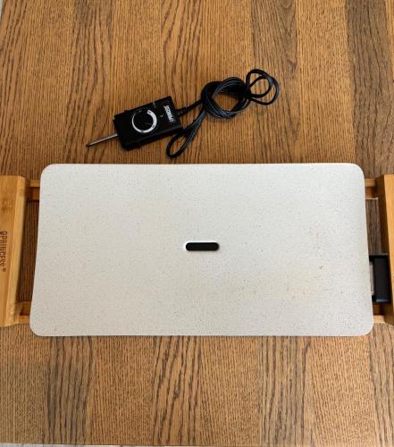 a laptop on a wooden floor with a pair of glasses at Hoshizora Terrace Minamiizu - Vacation STAY 08878v in Minamiizu