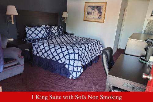 a hotel room with a bed and a desk at Coratel Inn & Suites by Jasper Hutchinson in Hutchinson