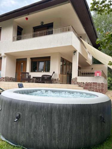 a large pool in front of a house at Villa Amity in Varna City