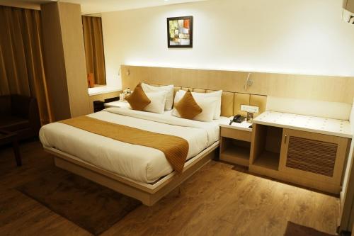 Cama o camas de una habitación en Hotel Radiance