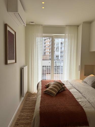 Ένα ή περισσότερα κρεβάτια σε δωμάτιο στο Appartement gelegen op 100 meter van het strand