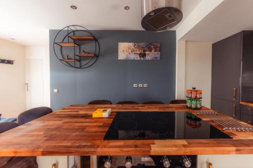 a dining room with a wooden table in a room at Luxury Seaview Cottage by Fairy Pools 3 in Carbost