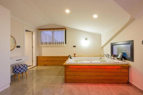 a large bathroom with a large bath tub at Aura luxury-Modern Stylish Central Holiday Villa For 6 Peeople in Fethiye