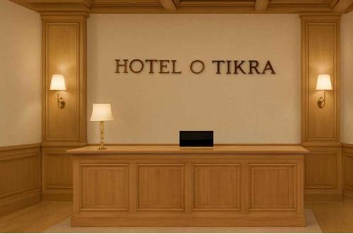 a hotel o tika sign on the wall of a building at Hotel O ONMT Inter College Kanpur Formerly Mangalam Palace in Panki