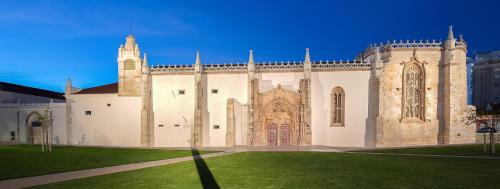 a large building with a tower and a church at Apartamento na marina com vista 180º junto à praia in Setúbal