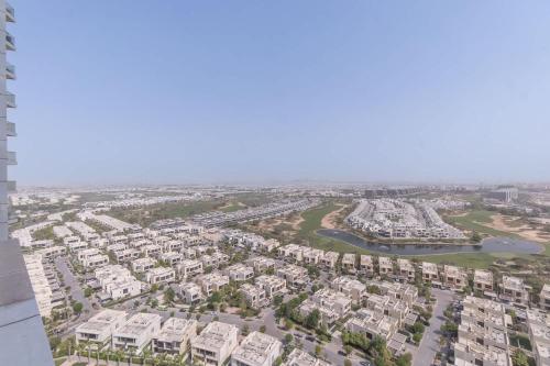 an aerial view of a city with houses at Damac Hills sleeps 2 with Private Balcony in Dubai Marina